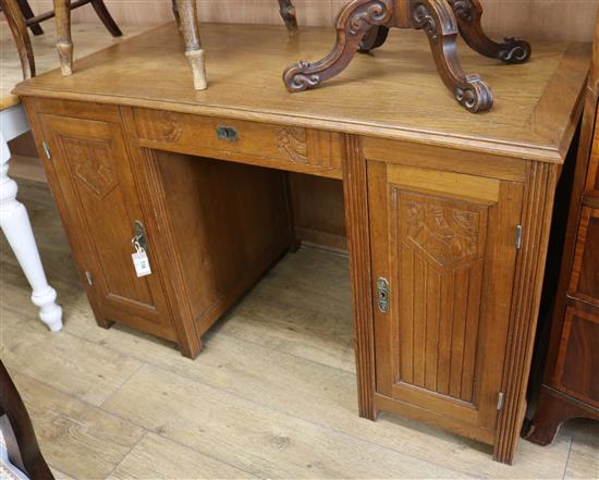 An Art Deco oak pedestal desk W.130cm